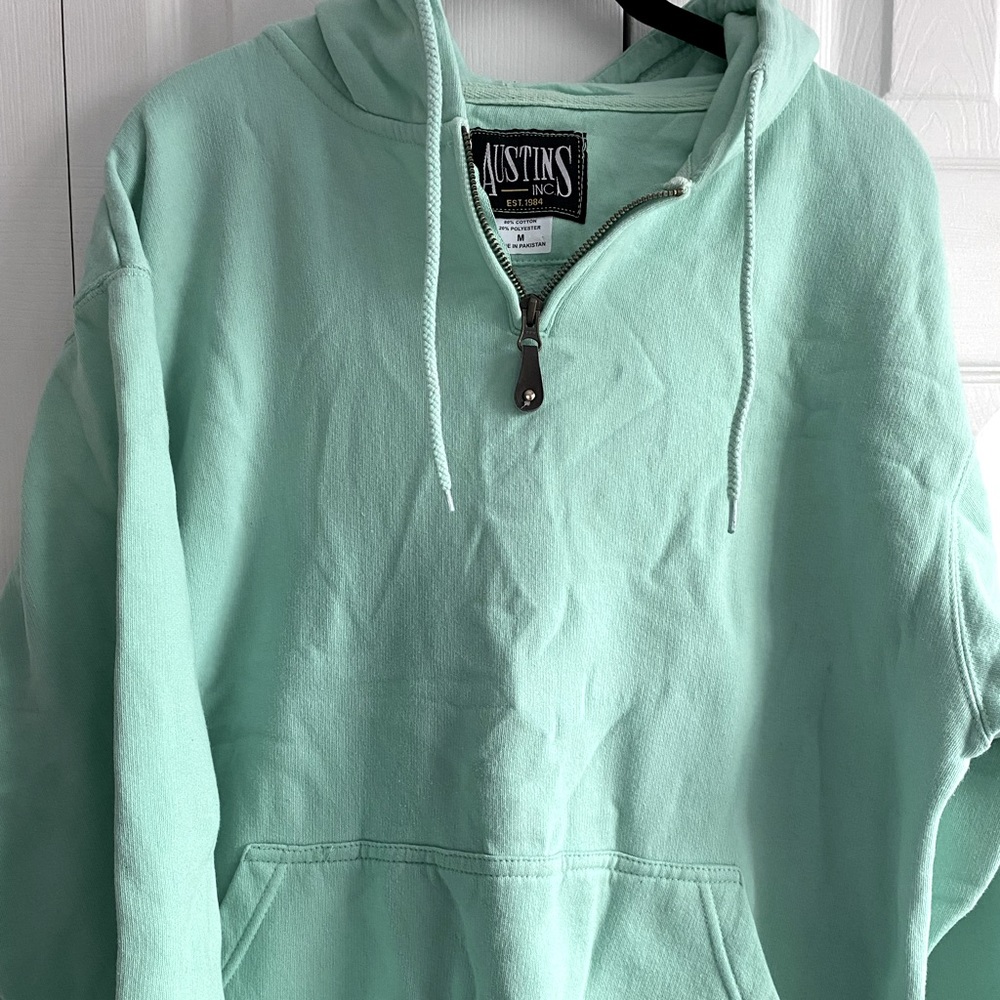 Austin’s sea foam hooded quarter zip pullover
